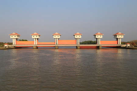 Bang Pakong Dam  are adjustable gates used to control water flow in flood barriers, river, at Chachoengsao  Province, Thailandの写真素材