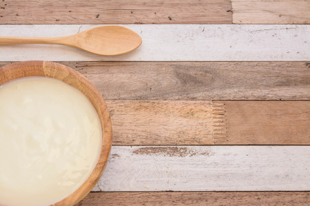 Yogurt on bowl wood with breakfastの写真素材