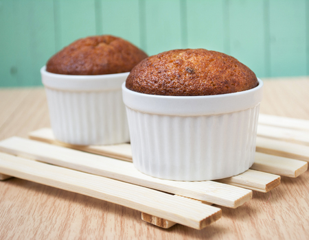 banana muffin cake on wooden backgroundの写真素材
