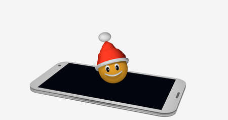 Emoticon with Santa hat on the display of a mobile phone. 3d renderingの写真素材