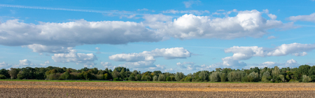 Countryside panorama with clouds sky with forest and field. Location: Germany, North Rhine - Westphalia, Borkenの写真素材