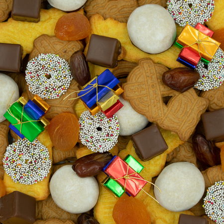 square christmas background from different varieties of christmas cookies and sweets.View from aboveの写真素材