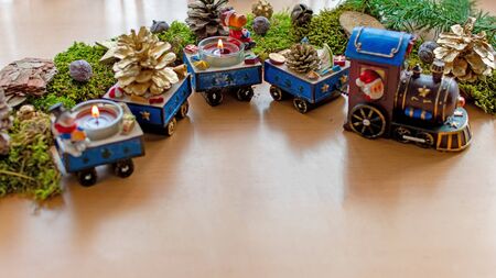 Christmas train with burning candles and christmas decorationsの写真素材