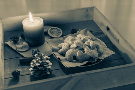 Plate of delicious vanilla crescents on a wooden trayの写真素材