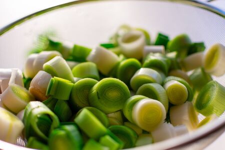 freshly cut leek in a colander. In close-up.の写真素材
