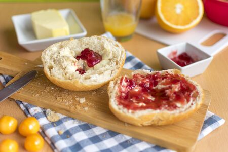 crisp breakfast rolls with jam. Delicious physalis and fresh orange juiceの写真素材
