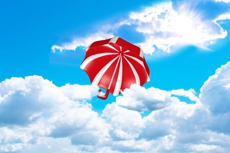 red and white striped umbrella flies out of the clouds towards the sun. 3d renderingの写真素材