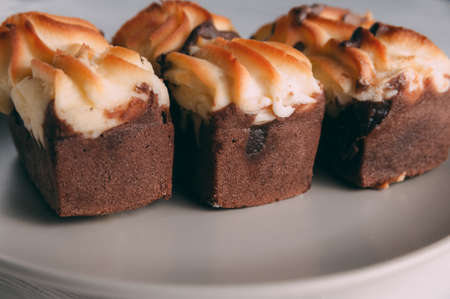 curd cake in a plate lies on a wooden backgroundの写真素材