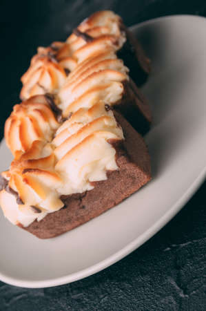 curd cake in a plate lies on a wooden backgroundの写真素材