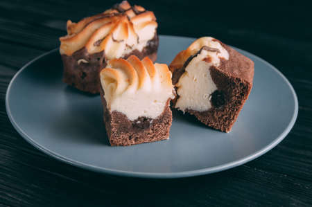 curd cake in a plate lies on a wooden backgroundの写真素材
