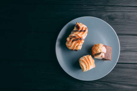 curd cake in a plate lies on a wooden backgroundの写真素材