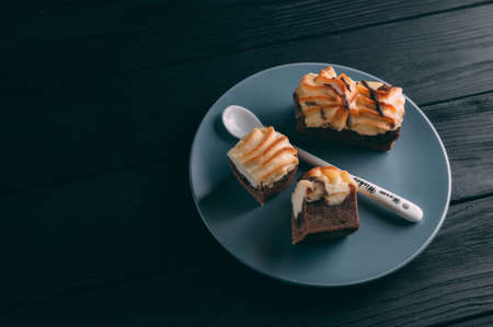 curd cake in a plate lies on a wooden backgroundの写真素材