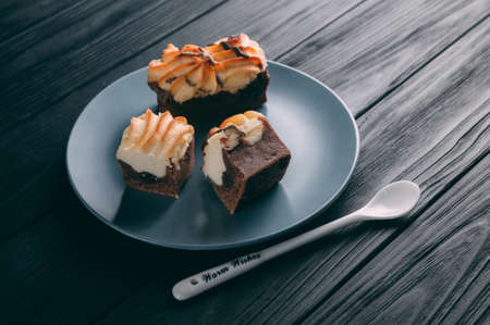 curd cake in a plate lies on a wooden backgroundの写真素材