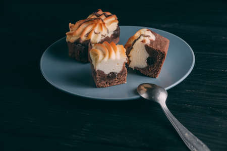 curd cake in a plate lies on a wooden backgroundの写真素材