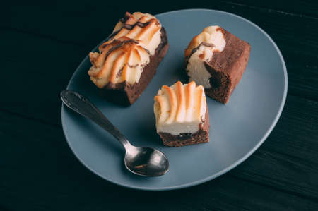 curd cake in a plate lies on a wooden backgroundの写真素材