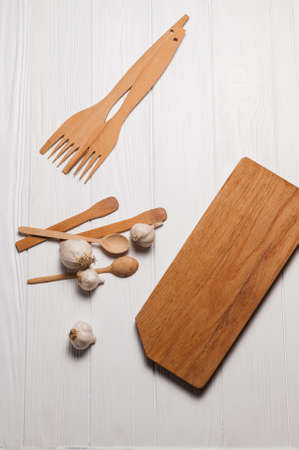Fresh sliced garlic in glass bowl on wooden background.の写真素材