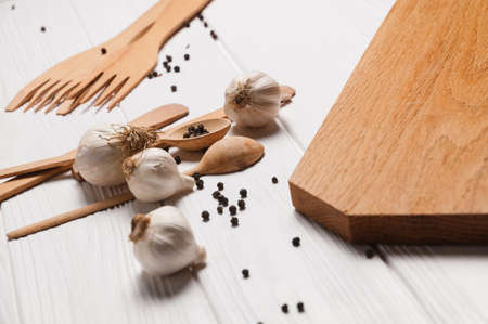 Fresh sliced garlic in glass bowl on wooden background.の写真素材