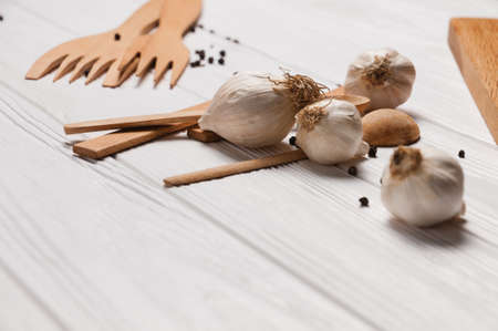 Fresh sliced garlic in glass bowl on wooden background.の写真素材