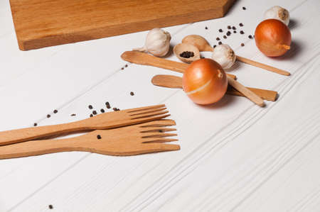 Fresh sliced garlic in glass bowl on wooden background.の写真素材