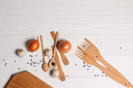 Fresh sliced garlic in glass bowl on wooden background.の写真素材