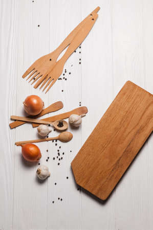 Fresh sliced garlic in glass bowl on wooden background.の写真素材
