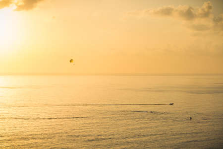 Background colorful sky concept: Dramatic sunset with a boat without clouds. Alanya, Turkey, the Mediterranean Seaの写真素材