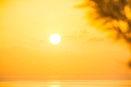 Inspirational calm sea with sunset sky. Meditation ocean and sky background. Colorful horizon over the waterの写真素材