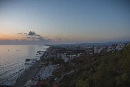 Background colorful sky concept: Dramatic sunset with clouds, overlooking the city. Alanya, Turkey, the Mediterranean Sea. Panoramicの写真素材
