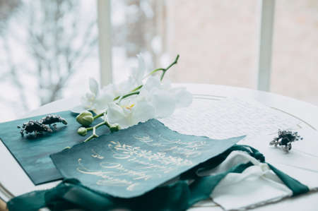 Wedding floristics and details. Wedding invitations. Orchid. Boutonniere for the groom. Wedding...