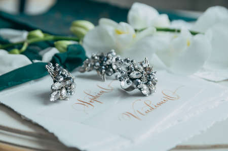 Wedding floristics and details. Wedding invitations. Orchid. Boutonniere for the groom. Wedding rings. Butterflyの写真素材