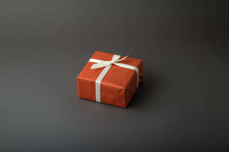 Gift box on a dark background. Top view with place for textの写真素材