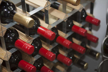 photo of wine bottles on a wine rackの写真素材