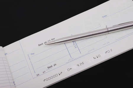 Check book and penの写真素材