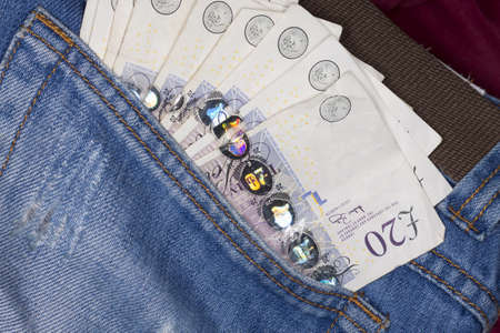Photo of money in jeans pocket