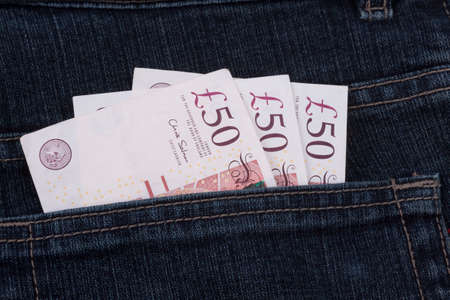 money in a jeans pocket