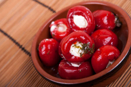 sweet red peppers stuffed with soft cream cheeseの写真素材
