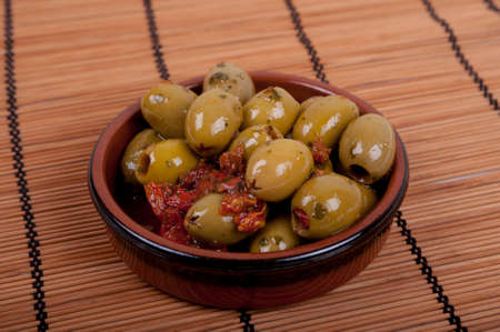 terracotta bowl of olivesの写真素材