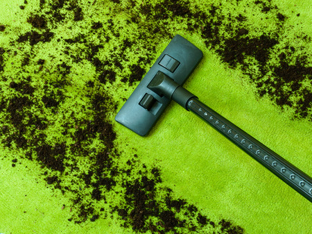 Photo Of Vacuum Cleaner Cleaning Dirt On Carpet. Spring Cleaning Conceptの写真素材