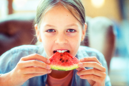 Girl eating watermelon - Young beautiful girl - Caucasian model - vintage, nostalgic version