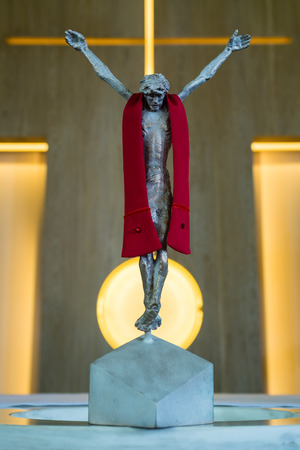 Poznan - Krzesiny, Poland - May 8, 2013: Bronze Statue of Jesus Christ crucified on a cross in a church, Poznan - Krzesiny, Polandのeditorial素材