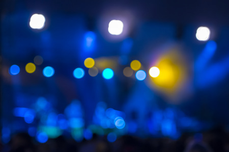 Defocused entertainment concert bokeh lighting on stage, blurred disco partyの写真素材
