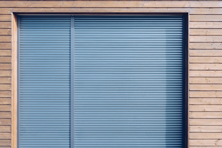 modern wooden siding with gray aluminum shutters の写真素材