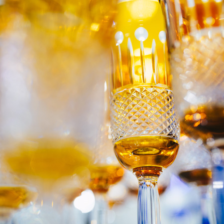 Orange glasses in a row - texture with light behind - for backgroundの写真素材