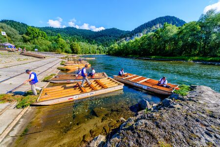 Sromowce Nizne, Poland - August 26, 2015; Traditional rafting on the Dunajec River on wooden boats. The rafting is very popular tourist attraction in Pieniny National Parkのeditorial素材