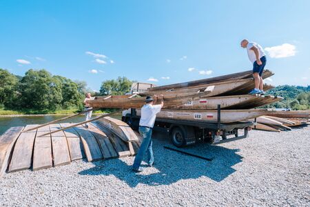 Sromowce Nizne, Poland - August 26, 2015; Traditional rafting on the Dunajec River on wooden boats. The rafting is very popular tourist attraction in Pieniny National Parkのeditorial素材