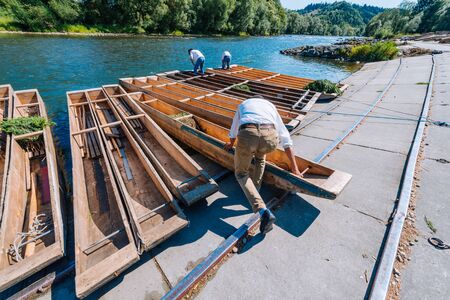Sromowce Nizne, Poland - August 26, 2015; Traditional rafting on the Dunajec River on wooden boats....