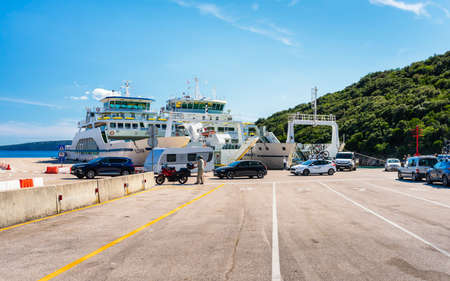 Valbiska, Croatia - June 26; 2021; Jadrolinija ferry crossing in Croatia - Valbiska (Krk) - Merag (Cres) lineのeditorial素材