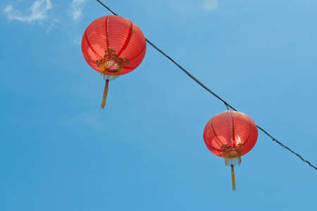 Two Chinese lanterns hang on the wireの写真素材