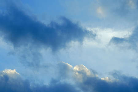 dark fuzzy clouds on the blue sky