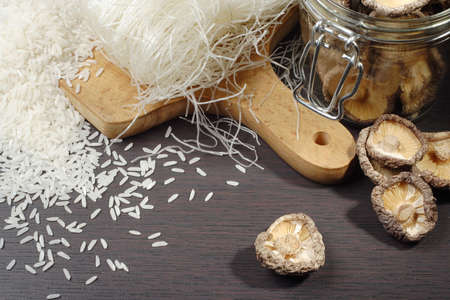 still life with shiitake mushrooms (Poku) (Lentinus edodes), rice nodles and rice grainの写真素材